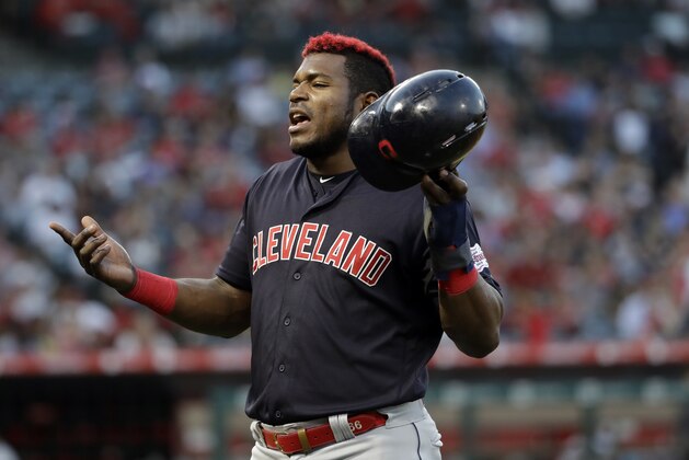 Cleveland Indians' Yasiel Puig walks back to the dugout during a baseball game against the Los Angeles Angels Wednesday, Sept. 11, 2019, in Anaheim, Calif. (AP Photo/Marcio Jose Sanchez)