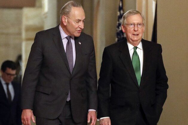 FILE - In this Feb. 7, 2018, file photo, Senate Majority Leader Mitch McConnell, R-Ky., and Senate Minority Leader Chuck Schumer, D-N.Y., left, walk to the chamber the Capitol in Washington. Some of the old timers in the Senate are getting fed up with the drought of legislation. But after weeks of focus on approving President Trump’s backlog of nominees, there’s a chance the chamber will soon be stretching its legs again. (AP Photo/Pablo Martinez Monsivais, File)
