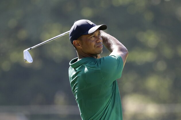 Tiger Woods hits toward the eleventh green during the third round of the Memorial golf tournament, Saturday, July 18, 2020, in Dublin, Ohio. (AP Photo/Darron Cummings)