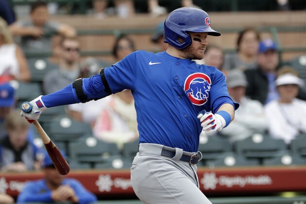 Chicago Cubs' Ian Happ hits against the San Francisco Giants during the first inning of a spring training baseball game Tuesday, March 10, 2020, in Scottsdale, Ariz. (AP Photo/Matt York)