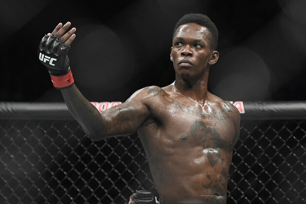 Nigeria's Israel Adesanya poses as he fights Brazil's Anderson Silva in their middleweight bout at the UFC 234 event in Melbourne, Australia, Sunday, Feb. 10, 2019. (AP Photo/Andy Brownbill)