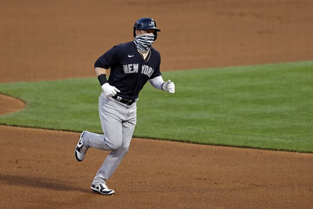 New York Yankees' Clint Frazier rounds the bases after hitting a two-run home run against the New York Mets during the fourth inning of a baseball spring training game Saturday, July 18, 2020, in New York. (AP Photo/Adam Hunger)