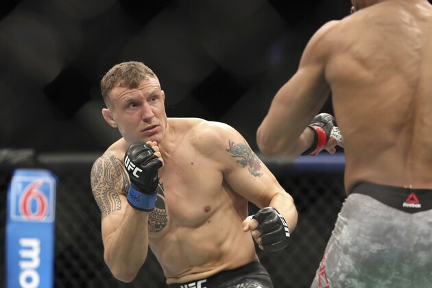 Jack Hermansson, left, in action against David Branch during their mixed martial arts bout at UFC Fight Night, Saturday, March 30, 2019, in Philadelphia. Hermansson won via first round submission. (AP Photo/Gregory Payan)