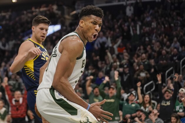 Milwaukee Bucks' Giannis Antetokounmpo reacts after his dunk during the second half of an NBA basketball game against the Indiana Pacers Wednesday, March 4, 2020, in Milwaukee. The Bucks won 119-100. (AP Photo/Morry Gash)