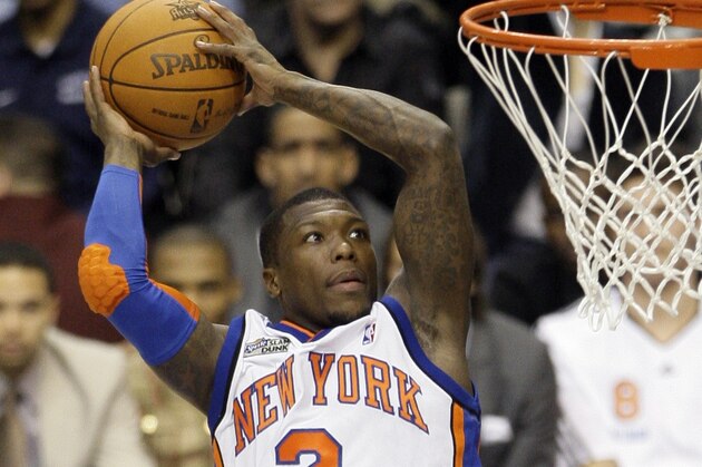 New York Knicks' Nate Robinson leaps during the slam dunk contest during the NBA basketball All-Star Saturday Night on Saturday, Feb. 13, 2010, in Dallas. (AP Photo/Tony Gutierrez)
