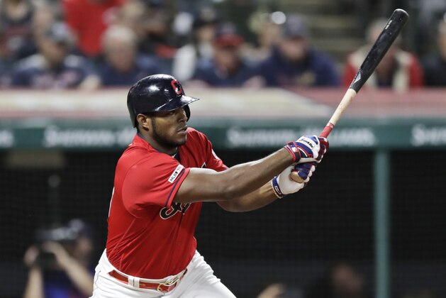 Cleveland Indians' Yasiel Puig watches his RBI single during the eighth inning of the team's baseball game against the Detroit Tigers, Tuesday, Sept. 17, 2019, in Cleveland. (AP Photo/Tony Dejak)