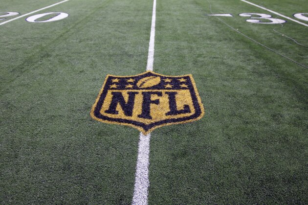 The gold colored NFL emblem is shown on the 25 yard line during an NFL football game between the New York Jets andDallas Cowboys on Saturday, Dec. 19, 2015, in Arlington, Texas. (AP Photo/Roger Steinman)