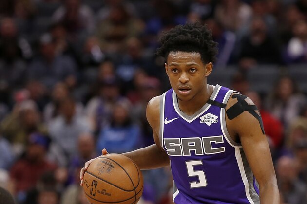 Sacramento Kings guard De'Aaron Fox dribbles down court during the second half of an NBA basketball game against the Toronto Raptors in Sacramento, Calif., Sunday, March 8, 2020. The Raptors won 118-113. (AP Photo/Rich Pedroncelli)