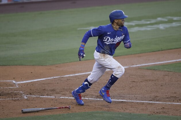 Los Angeles Dodgers' Mookie Betts lines out to center field during the fourth inning of an exhibition baseball game against the Arizona Diamondbacks Sunday, July 19, 2020, in Los Angeles. (AP Photo/Marcio Jose Sanchez)