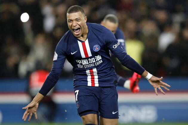PSG's Kylian Mbappe celebrates his goal against Bordeaux during the French League One soccer match between Paris-Saint-Germain and Bordeaux at the Parc des Princes stadium in Paris, Sunday Feb. 23, 2020. (AP Photo/Christophe Ena)
