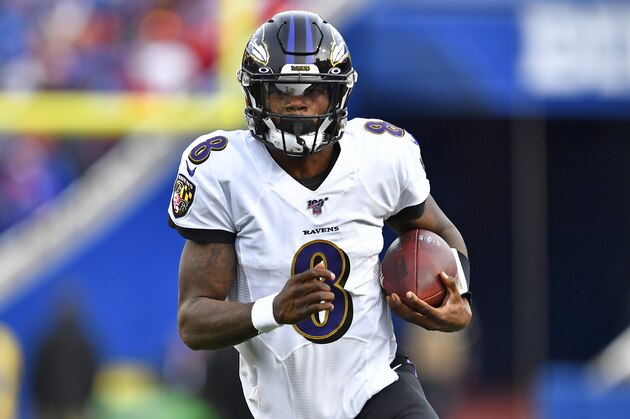 Baltimore Ravens quarterback Lamar Jackson (8) carries the ball during the second half of an NFL football game against the Buffalo Bills in Orchard Park, N.Y., Sunday, Dec. 8, 2019. (AP Photo/Adrian Kraus)