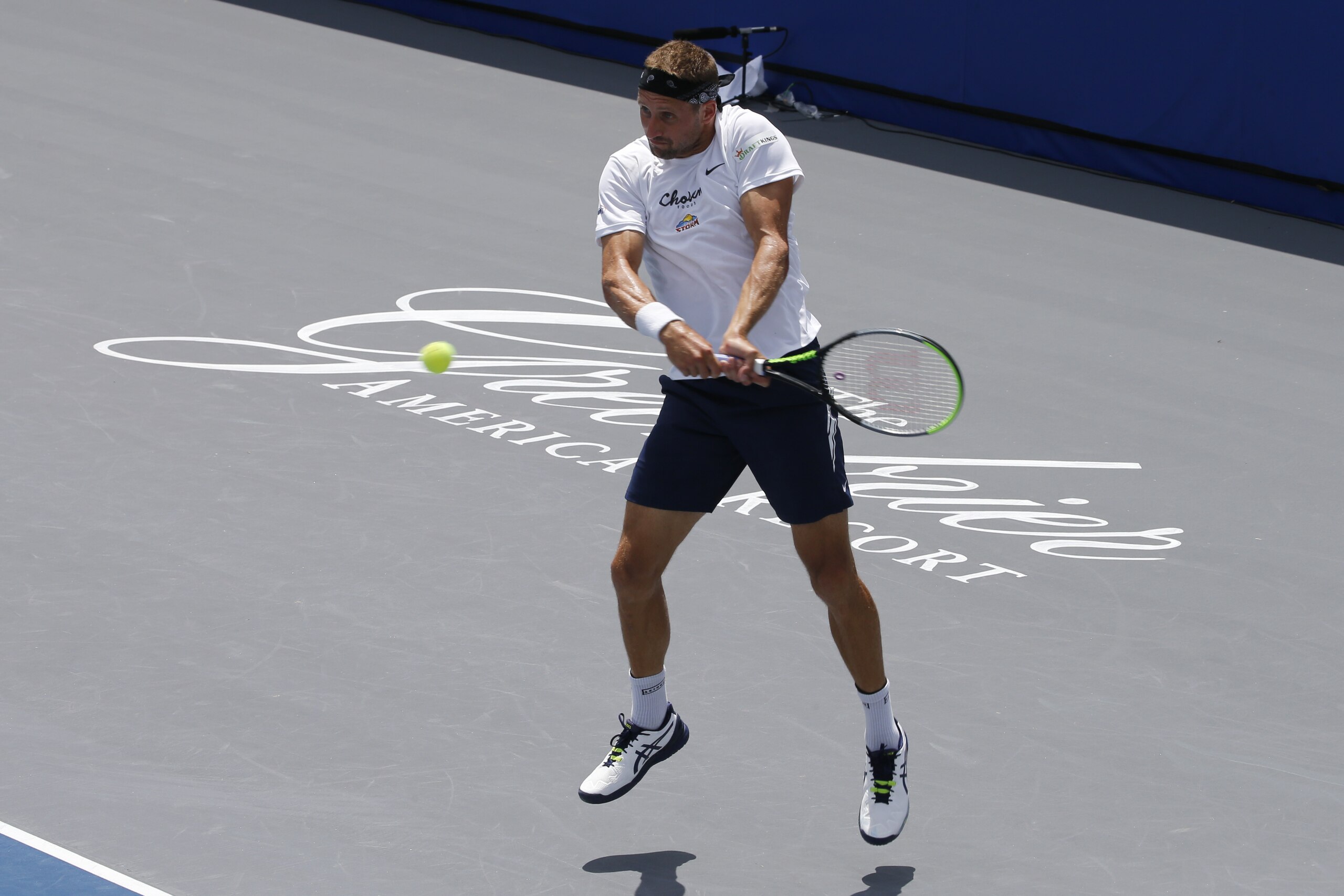 Orlando Storm player Tennys Sandgren, returns a serve at the start of the Worldteam Tennis tournament at The Greenbrier Resort Sunday July 12, 2020, in White Sulphur Springs, W.Va. (AP Photo/Steve Helber)