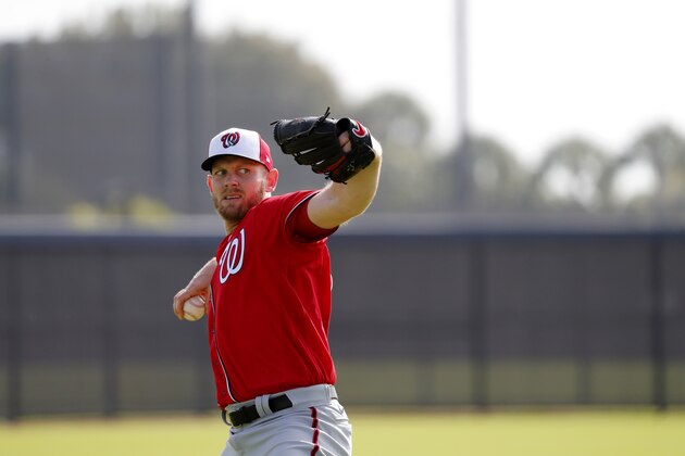 Washington Nationals pitcher Stephen Strasburg throws during spring training baseball practice Friday, Feb. 14, 2020, in West Palm Beach, Fla. (AP Photo/Jeff Roberson)