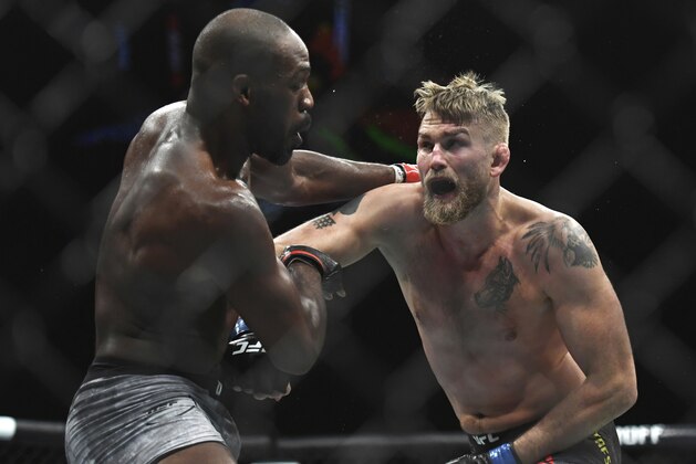 Alexander Gustafsson, right, lands a punch to Jon Jones during the UFC men's light heavyweight title mixed martial arts bout at UFC 232, Saturday, Dec. 29, 2018, in Inglewood, Calif. (AP Photo/Kyusung Gong)