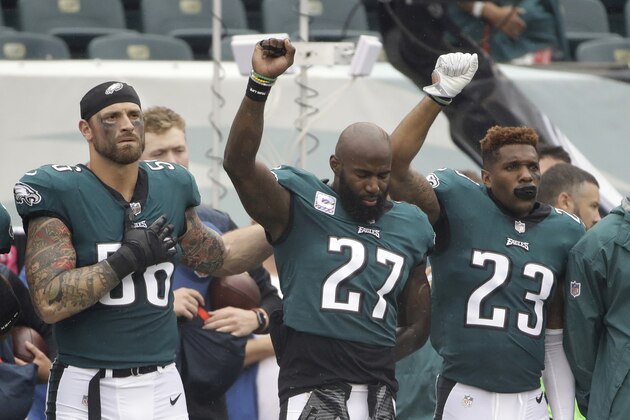 FILE - In this Oct. 8, 2017, file photo, Philadelphia Eagles' Chris Long (56), Malcolm Jenkins (27) and Rodney McLeod (23) gesture during the National Anthem before an NFL football game against the Arizona Cardinals, in Philadelphia. Baltimore’s Ben Watson and Philadelphia’s Malcolm Jenkins have strong views toward anthem protests and those who oppose them, based on their religious beliefs. But even pastors can’t agree on the controversial topic that has enveloped the NFL this season. (AP Photo/Matt Rourke, File)
