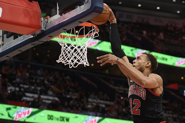 Chicago Bulls forward Daniel Gafford (12) goes to the basket during the first half of an NBA basketball game against the Washington Wizards, Wednesday, Dec. 18, 2019, in Washington. (AP Photo/Nick Wass)