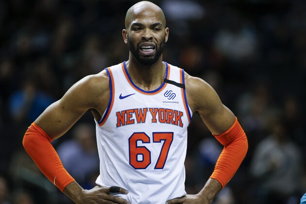 New York Knicks center Taj Gibson stands on the court during a break in the action in the first half of an NBA basketball game against the Charlotte Hornets in Charlotte, N.C., Tuesday, Jan. 28, 2020. (AP Photo/Nell Redmond)
