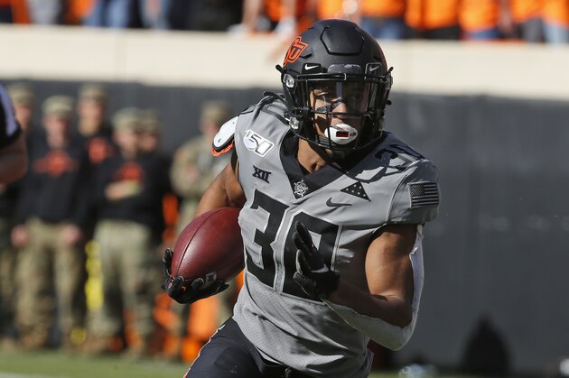 Oklahoma State running back Chuba Hubbard (30) during an NCAA college football game in Stillwater, Okla., Saturday, Nov. 16, 2019. (AP Photo/Sue Ogrocki)