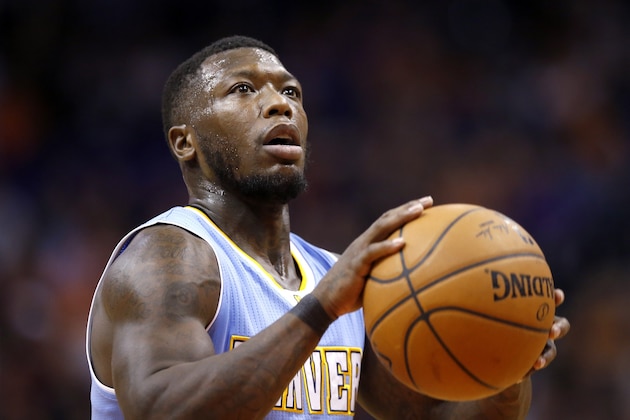 Denver Nuggets' Nate Robinson shoots a foul shot during the first half of an NBA basketball game against the Phoenix Suns Wednesday, Nov. 26, 2014, in Phoenix. (AP Photo/Ross D. Franklin)