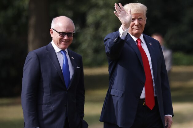 U.S. President Donald Trump leaves Winfield House, residence of the US Ambassador Woody Johnson, left, before boarding Marine One helicopter for the flight to Chequers, in Buckinghamshire, Friday, July 13, 2018 in London. Trump is in London, where his day will start with a viewing of a military demonstration before he heads to meetings with British Prime Minister Theresa May at Chequers, May's county house. (AP Photo/Pablo Martinez Monsivais)