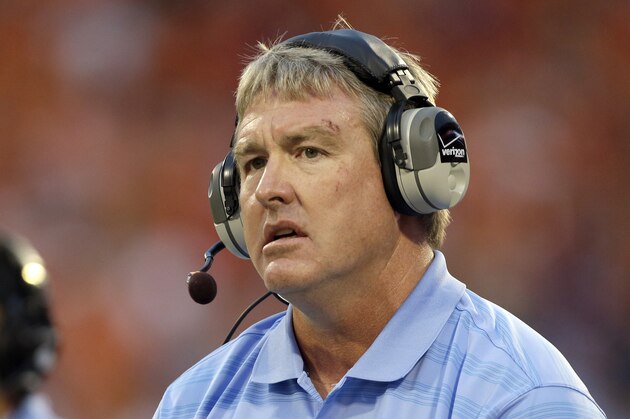 FILE - In this Sept. 27, 2014, file photo, Vic Koenning, at the time the defensive coordinator at North Carolina, watches during the first half of the team's NCAA college football game against Clemson in Clemson, S.C. West Virginia has placed defensive coordinator Koenning on administrative leave after a player alleged the assistant coach made a series of inappropriate comments. West Virginia athletic director Shane Lyons announced the move Tuesday, June 23, 2020, after safety Kerry Martin posted the allegations on his Twitter account. (AP Photo/Bob Leverone, File)