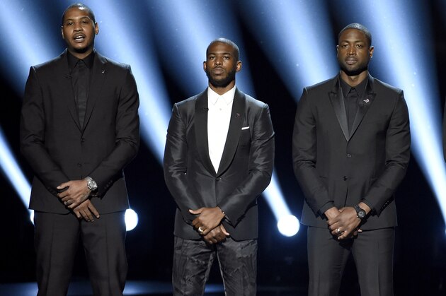 FILE - In this July 13, 2016, file photo, NBA basketball players Carmelo Anthony, Chris Paul, Dwyane Wade and LeBron James, from left, speak on stage at the ESPY Awards in Los Angeles. The four gave an anti-violence speech and expressed their support of the values behind the Black Lives Matter movement.(Photo by Chris Pizzello/Invision/AP, File)
