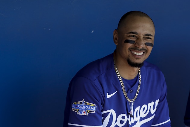 Los Angeles Dodgers right fielder Mookie Betts looks on from the dugout before a spring training baseball game against the Chicago White Sox, Monday, Feb. 24, 2020, in Glendale, Ariz. (AP Photo/Gregory Bull)