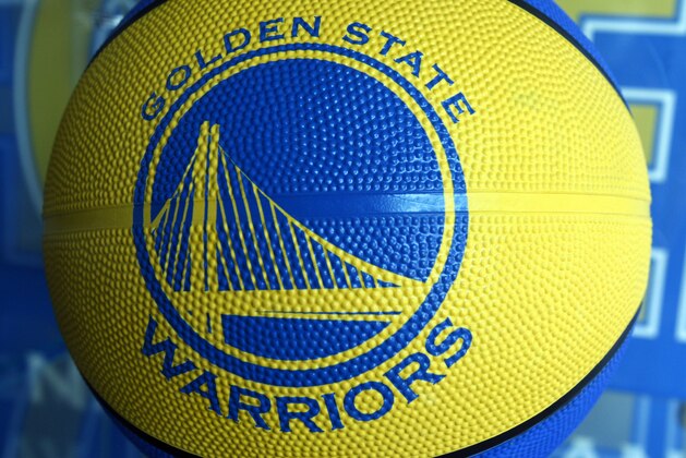 The new Golden State Warrior logo is seen on a basketball for sale at the Warrior team store Wednesday, July 14, 2010, in Oakland, Calif.  Golden State Warriors owner Chris Cohan reached an agreement Thursday to sell the franchise for a record $450 million to Boston Celtics minority partner Joe Lacob and Mandalay Entertainment CEO Peter Guber. (AP Photo/Ben Margot)