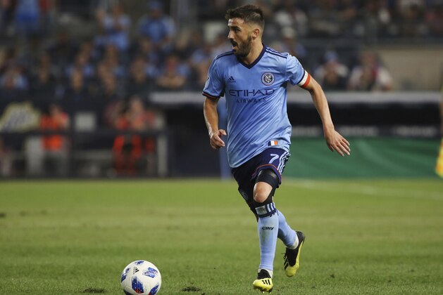 NYCFC forward David Villa moves the ball up the pitch during the second half of an MLS soccer match against the New York Red Bulls, Wednesday, Aug. 22, 2018, in New York. The match ended in a 1-1 draw. (AP Photo/Steve Luciano) NYCFC forward David Villa moves the ball up the pitch during the second half of an MLS soccer match against the New York Red Bulls, Wednesday, Aug. 22, 2018, in New York. The match ended in a 1-1 draw. (AP Photo/Steve Luciano)