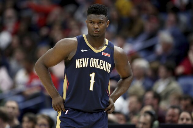 New Orleans Pelicans forward Zion Williamson walks onto the court during the second half of the team's NBA basketball game against the Miami Heat in New Orleans, Friday, March 6, 2020. (AP Photo/Rusty Costanza) New Orleans Pelicans forward Zion Williamson walks onto the court during the second half of the team's NBA basketball game against the Miami Heat in New Orleans, Friday, March 6, 2020. (AP Photo/Rusty Costanza)