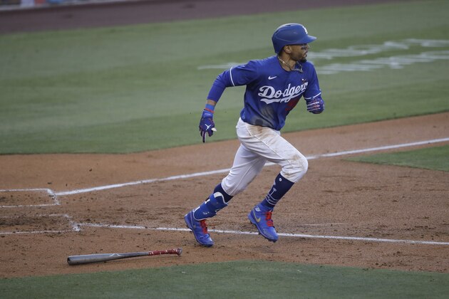 Los Angeles Dodgers' Mookie Betts lines out to center field during the fourth inning of an exhibition baseball game against the Arizona Diamondbacks Sunday, July 19, 2020, in Los Angeles. (AP Photo/Marcio Jose Sanchez)
