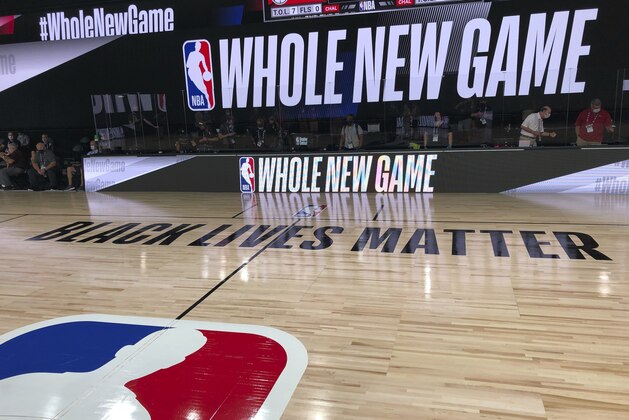 A basketball court is shown at the ESPN Wide World of Sports complex in Kissimmee, Fla., Tuesday, July 21, 2020. The NBA's marketing motto for the restart of the season at Walt Disney World is “Whole New Game,” and in many respects, that’s very true. (AP Photo/Tim Reynolds)