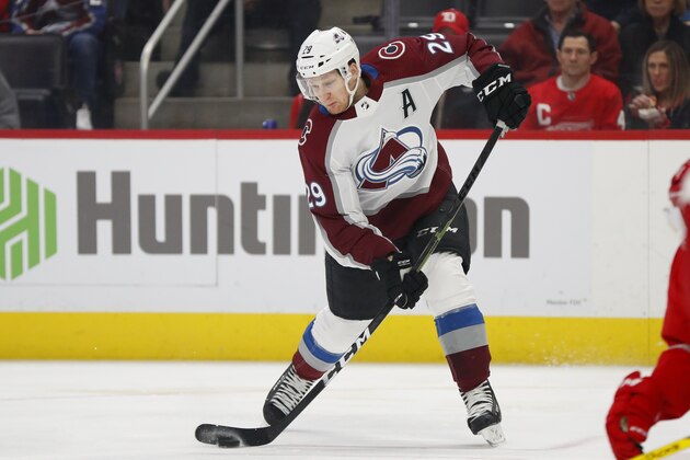 Colorado Avalanche center Nathan MacKinnon (29) shoots against the Detroit Red Wings in the first period of an NHL hockey game Monday, March 2, 2020, in Detroit. (AP Photo/Paul Sancya)