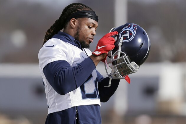 Tennessee Titans running back Derrick Henry puts on his helmet during an NFL football practice Thursday, Jan. 16, 2020, in Nashville, Tenn. The Titans are scheduled to face the Kansas City Chiefs in the AFC Championship game Sunday. (AP Photo/Mark Humphrey)
