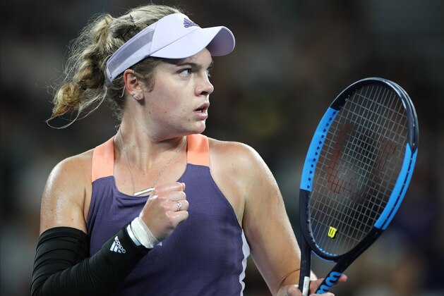 Catherine McNally of the United States reacts after winning a point against Australia's Samantha Stosur during their first round singles match the Australian Open tennis championship in Melbourne, Australia, Monday, Jan. 20, 2020. (AP Photo/Andy Wong)