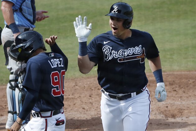 Atlanta Braves' Austin Riley celebrates his two-run homer during a spring training baseball game against the Tampa Bay Rays, Tuesday, March 3, 2020, in Venice, Fla. (AP Photo/Elise Amendola)