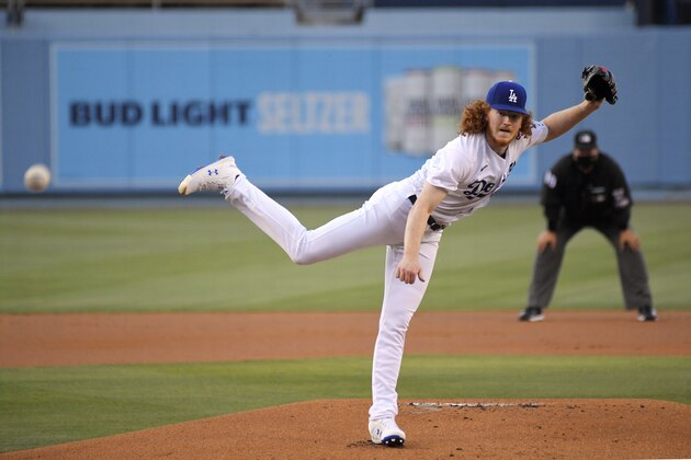Los Angeles Dodgers starting pitcher Dustin May throws to the plate during the first inning of an opening day baseball game against the San Francisco Giants, Thursday, July 23, 2020, in Los Angeles. (AP Photo/Mark J. Terrill)