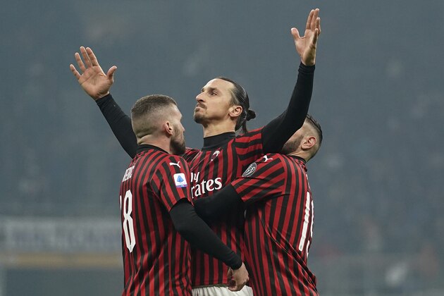 AC Milan's Zlatan Ibrahimovic, center, celebrates with teammates Ante Rebic, left, and Theo Hernandez after scoring his side's second goal during the Serie A soccer match between Inter Milan and AC Milan at the San Siro Stadium, in Milan, Italy, Sunday, Feb. 9, 2020. (Spada/Lapresse via AP)