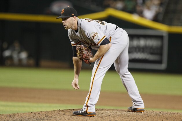 San Francisco Giants pitcher Sam Coonrod looks for a sign against the Arizona Diamondbacks during the seventh inning of a baseball game Thursday, Aug. 15, 2019, in Phoenix. (AP Photo/Darryl Webb)