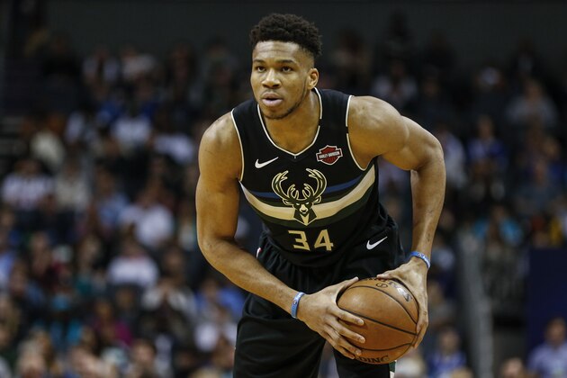 Milwaukee Bucks forward Giannis Antetokounmpo runs the offense against the Charlotte Hornets in the first half of an NBA basketball game in Charlotte, N.C., Sunday, March 1, 2020. Milwaukee won 93-85. (AP Photo/Nell Redmond)