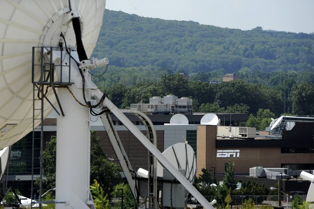 FILE - In this Aug. 2, 2011 file photo, satellite dishes dot the campus of ESPN in Bristol, Conn. ESPN has begun removing its videos from YouTube due to rights and legal issues surrounding next week’s launch of YouTube’s ad-free subscription service, Red. (AP Photo/Jessica Hill, File)