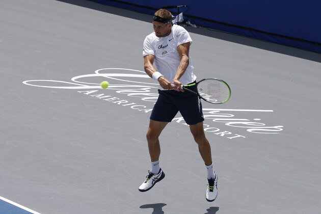 Orlando Storm player Tennys Sandgren, returns a serve at the start of the Worldteam Tennis tournament at The Greenbrier Resort Sunday July 12, 2020, in White Sulphur Springs, W.Va. (AP Photo/Steve Helber) Orlando Storm player Tennys Sandgren, returns a serve at the start of the Worldteam Tennis tournament at The Greenbrier Resort Sunday July 12, 2020, in White Sulphur Springs, W.Va. (AP Photo/Steve Helber)