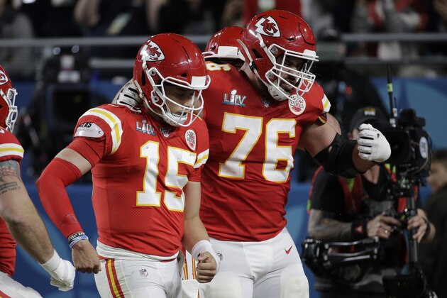 Kansas City Chiefs quarterback Patrick Mahomes (15) celebrates his touchdown with Kansas City Chiefs' Laurent Duvernay-Tardif (76) the San Francisco 49ers during the first half of the NFL Super Bowl 54 football game Sunday, Feb. 2, 2020, in Miami Gardens, Fla. (AP Photo/Patrick Semansky)