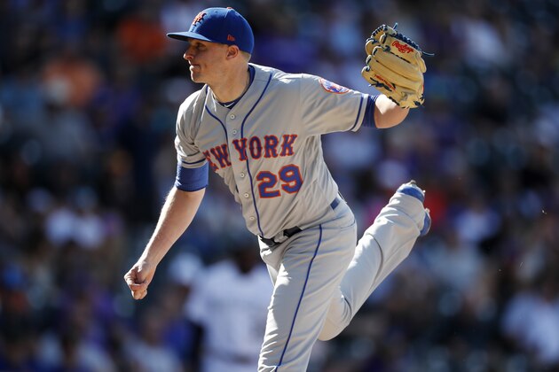 New York Mets relief pitcher Brad Brach works against the Colorado Rockies in the seventh inning of a baseball game Wednesday, Sept. 18, 2019, in Denver. (AP Photo/David Zalubowski)
