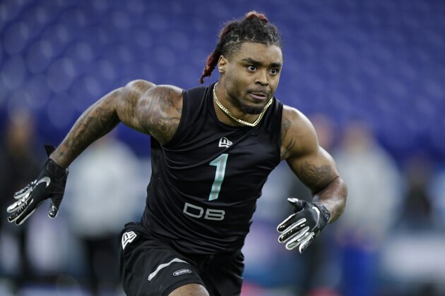 Ohio State defensive back Damon Arnette runs a drill at the NFL football scouting combine in Indianapolis, Sunday, March 1, 2020. (AP Photo/Michael Conroy)