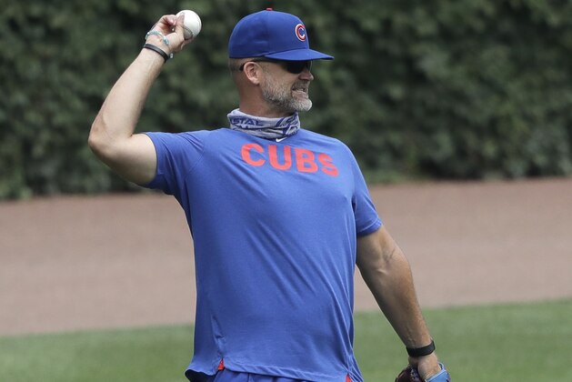 Chicago Cubs manager David Ross throws a ball during team's practice at Wrigley Field in Chicago, Wednesday, July 8, 2020. (AP Photo/Nam Y. Huh)
