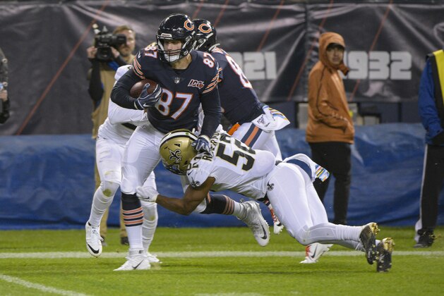 Chicago Bears tight end Adam Shaheen (87) its tackled by New Orleans Saints linebacker Craig Robertson (52) during the second half of an NFL football game in Chicago, Sunday, Oct. 20, 2019. (AP Photo/Mark Black)