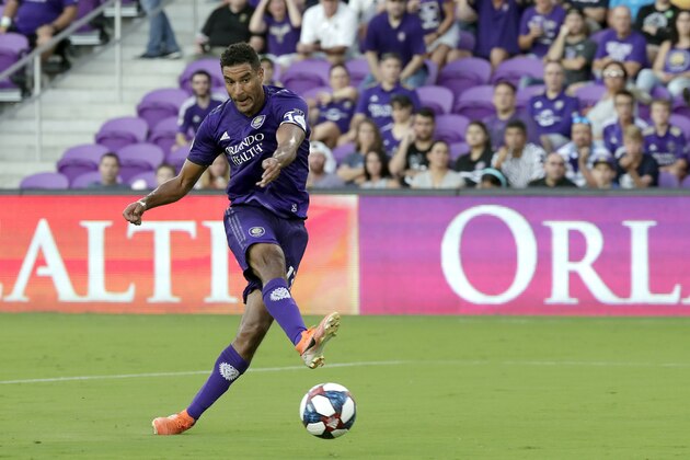 Orlando City forward Tesho Akindele shoots and scores a goal against FC Dallas during the first half of an MLS soccer match, Saturday, Aug. 3, 2019, in Orlando, Fla. (AP Photo/John Raoux)