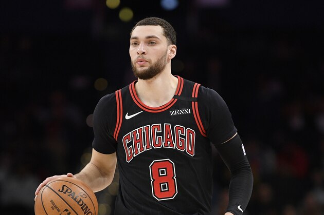 Chicago Bulls guard Zach LaVine (8) dribbles the ball during the first half of an NBA basketball game against the Washington Wizards, Tuesday, Feb. 11, 2020, in Washington. (AP Photo/Nick Wass)