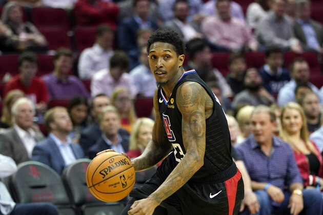 Los Angeles Clippers' Lou Williams (23) drives toward the basket against the Houston Rockets during the first half of an NBA basketball game Thursday, March 5, 2020, in Houston. (AP Photo/David J. Phillip)